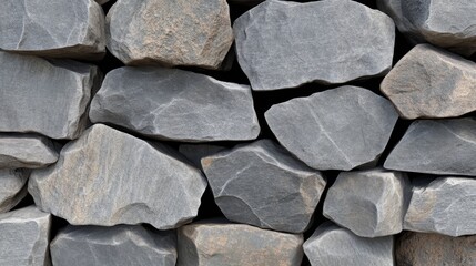 Sticker - A close-up image of a stone wall, showcasing the rough texture and natural beauty of the individual stones.  The  irregular shapes and varied sizes of the rocks create a visually interesting pattern. 