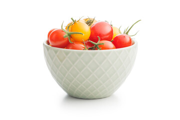 Wall Mural - Different colorful cherry tomatoes in bowl isolated on white background.