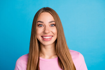 Photo portrait of lovely young lady excited cheerful smile dressed stylish pink garment isolated on blue color background