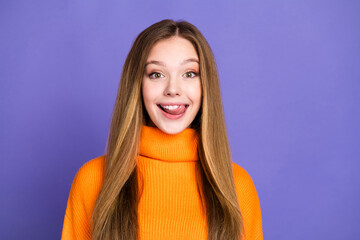 Poster - Portrait photo of youth charming blonde hair cute happy girl licking her teeth hungry in orange turtleneck isolated on violet color background