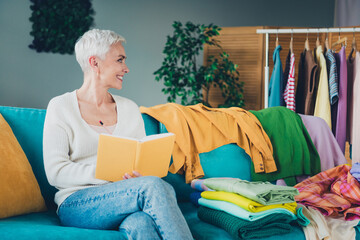 Poster - Photo of adorable woman dressed white cardigan reading planner cleaning tasks duties indoors house apartment room