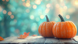 Dynia w kolorze pomarańczowym leżąca na drewnianym stole, na tle z bokeh w odcieniach ciepłych barw.