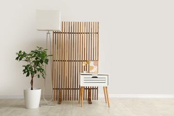 Poster - Interior of room with coffee table, houseplant, lamp and folding screen