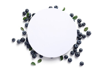 Wall Mural - Composition with blank paper sheet and fresh blueberry on light background