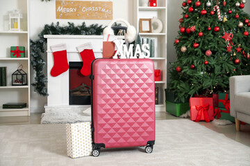 Sticker - Suitcase with earmuffs, passport and Christmas gift in living room