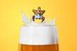 © BillionPhotos.com - Man in swimsuit floating at top of foamy beer glass
