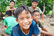 © tatsiana502 - Portrait of smiling asian boy looking at camera with friends in background