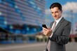 © BillionPhotos.com - Focused successful businessman with mobile phone