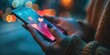 © RealPeopleStudio - hand holding a smartphone with a social media app open, notifications buzzing with heart or love signs.