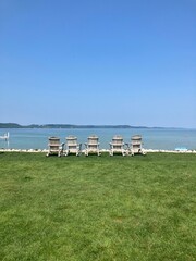 Adirondack chairs along the lake