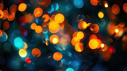 Vibrant orange and blue bokeh lights create a dynamic, colorful abstract scene against a dark background.