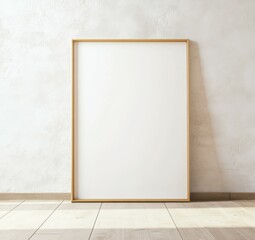 A slim golden picture frame stands against the wall, surrounded by wooden flooring and soft natural light, creating a serene and minimalistic atmosphere. Mockup