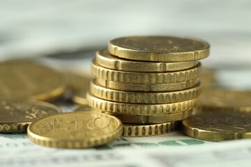 Wall Mural - Many euro coins on dollar banknotes, closeup