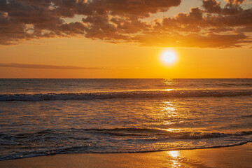 A yellow sunset on the beach