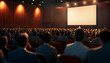 © Eddy Drmwn - Audience watching a presentation in a conference hall.