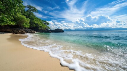 Wall Mural - Tranquil Beach Scene with White Sand, Foamy Waves, and Blue Sky