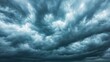 © VISUAL BACKGROUND - A dark blue sky with dark clouds over the ocean
