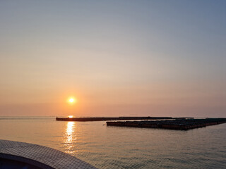 Wall Mural - Sunset view of the sea with a bow.