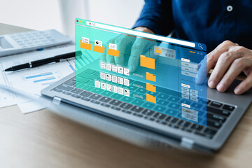 Businessman working on laptop with business and financial paperless report file, contract, plan, data and information. .Online e-document management software system workflow paperless office concept