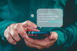 © ParinPIX - Man holding a smartphone and viewing messages on mobile phone. Fake Text message SMS scam or phishing concept.