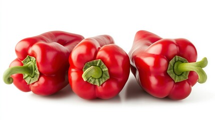 Wall Mural - Three vibrant red bell peppers arranged side by side on a white background.