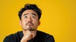 © _veiksme_ - Asian Male with Worried Expression Looking Upward in Thought