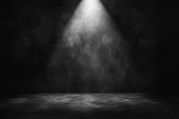 Black background and concrete floor in an empty studio room with spot lighting and smoke.