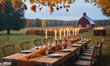 © Miklos - A long wooden table is set for dinner outdoors, with fall leaves overhead and a red barn in the background