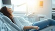 © Nadin Faust - relaxed woman in jeans and a white top lying on a dental chair, eyes closed, enjoying relaxation at the clinic during a break between appointments, sunlight streaming in from the window