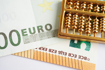 Wall Mural - Gold abacus on banknote money, finance trading investment business currency concept.