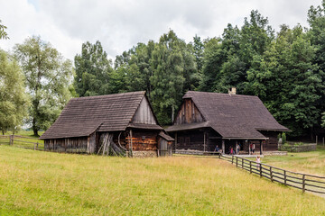 Wall Mural - ROZNOV POD RADHOSTEM, CZECH REPUBLIC - JULY 15, 2021: Wooden houses in the open air museum (Valasske muzeum v prirode) in Roznov pod Radhostem, Czechia