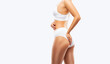 © Dimid - A slender woman in a white underwear on a white background. Healthy lifestyle, sport and diet.