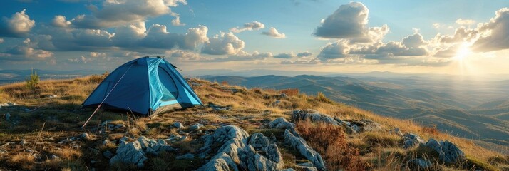 Wall Mural - A vibrant electric blue tent provides refuge on a rough hill under a vast sky, creating an enchanting landscape perfect for outdoor activities.