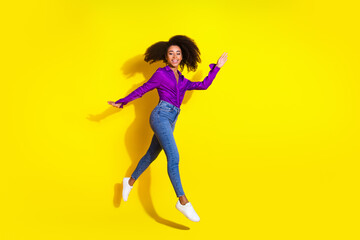 Sticker - Full body photo of pretty young girl running jump wear trendy violet outfit isolated on yellow color background