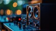 © Rossarin - Close-up of a professional audio speaker with bokeh background. Perfect for music production and sound engineering visuals.