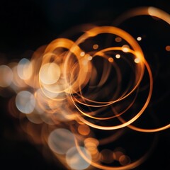 Poster - An intriguing image featuring golden rings of light against a dark background, forming an abstract visual effect that radiates warmth and exudes a luxurious and artistic ambiance.