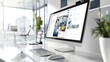 © Julia - Modern computer display on an office desk with a web design studio concept page. Web design company presentation