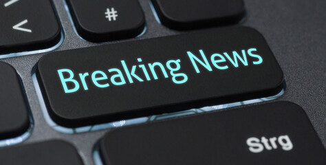 Wall Mural - illuminated keyboard with a labeled key - breaking news
