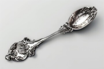Poster - A single silver spoon lying on a white surface