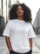 © Irina Sharnina - African american young woman plus size model in cotton plain white t-shirt on city street background. Big size clothing mock up for print or branding