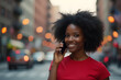 © Amir Bajric - smiling afro american woman talking on the phone on the street