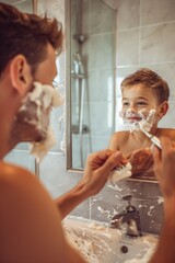 Wall Mural - A man shaves a young boy's face in a bathroom mirror, a grooming and family bonding moment