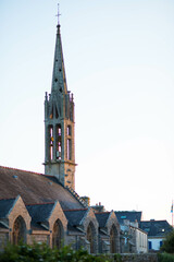 Sunset view of the church bell tower of Ile-Tudy, a charming village located in Finistere, Brittany, France. Vertical shot.