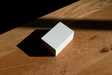 Corporate identity mockup on a wooden background, featuring blank paper documents, business branding, and office presentation materials, neatly arranged on a wooden table and desk.