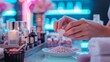© Vitalii Shkurko - A person carefully adds liquid to a bowl of pearl beads at a colorful beauty studio during a creative session in the evening