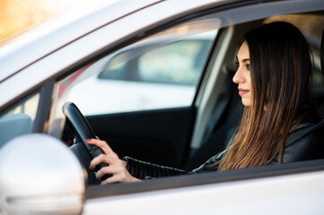 Young lady dviring her car