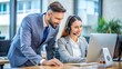 © Faiqdesigner - A call center supervisor coaching a new employee.