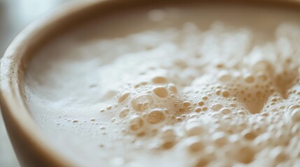 Canvas Print - Close-up of Beige Foamy Liquid in a Mug