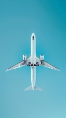 Poster - Aerial view of an airplane flying against a clear blue sky.