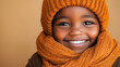 © Vivid_Vision - an African American boy wearing orange winter clothes, smiling